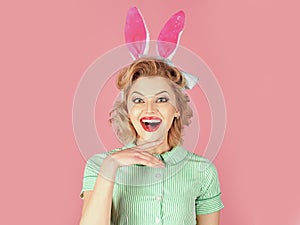Retro woman in bunny ears, easter. Easter, makeup, pinup party, girl in rabbit ears. Vintage look. Sexy blond girl with