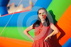 Retro Woman at Garden Party Near Bouncy House