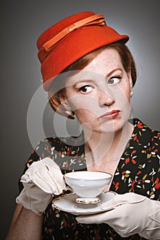 Retro Woman Passing Judgment While Drinking Tea
