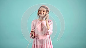 Retro woman with phone. pin-up woman in phoning with vintage telephone isolated on blue background. Funny call center.