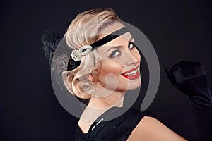 Retro woman portrait. Blonde wavy hairstyle. Hollywood red lips makeup. Curly hair style. Beautiful elegant female wears in