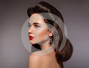 Retro woman portrait. Elegant brunette with red lips makeup and