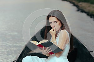 Retro Woman Reading a Book in a Vintage Boat