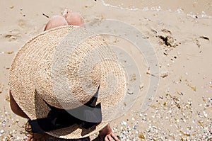 Retro woman at sea sand beach. Suntan at summer beach. Beach vacation of retro girl. Sea traveling. Woman on summer vacation at