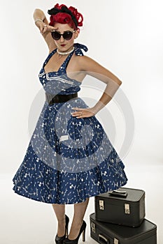 Retro woman style pinup with suitcases