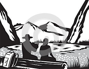 Male and Female Hiker Tramper Sitting on Log Reading with Backpack Woodcut photo