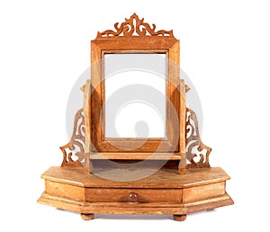 Retro wooden carving dressing table mirror isolated on white background. Thailand dressing table style photo