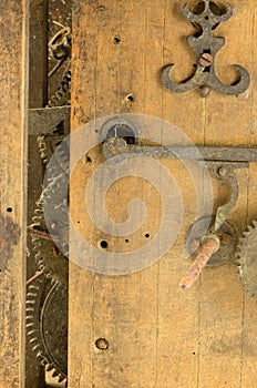 Retro wooden clock grunge mechanism gear closeup