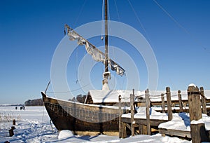 Retro wooden ship frozen lake ice sail people walk