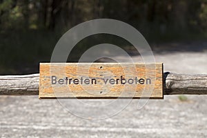 Retro wooden sign mounted to a wooden pole