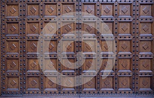 Retro wooden vintage style door outside old Italian house in Italy