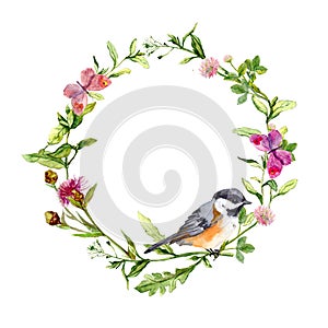 Retro wreath border frame with wild herbs, meadow flowers, bird and butterflies. Vintage watercolor