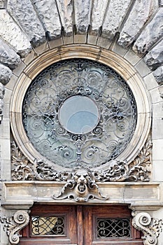 Retro wrought iron decoration above the entrance in Lviv, Ukraine