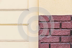 Retro yellow door red brick wall background texture