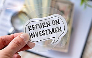 Return on Investmen text on white card on the chart background