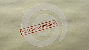 Return to Sender seal stamped on blank paper background, delivery failed photo
