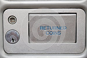 Returned coins slot