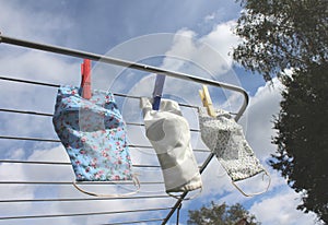 Reusable cloth face masks drying on a washing line