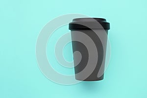 Reusable stylish eco friendly grey bamboo cup on mint background