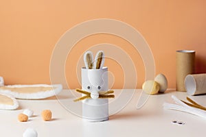 Reuse concept art from toilet tube. Eco friendly bunny craft. Handmade decoration easter rabbit. Kids DIY ideas.