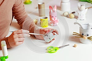 Reuse concept art from toilet tube. Eco friendly bunny craft. Handmade decoration easter rabbit. Kids DIY ideas