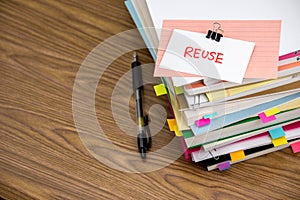 Reuse; The Pile of Business Documents on the Desk