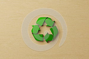 Reuse, reduce, recycle concept. Top view of recycle symbol on wooden background