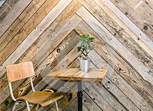 Reusing old wood boards to make herringbone or fishtail wall pattern in home room.