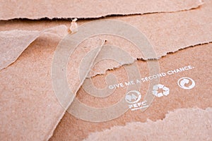 Reusing paper-based products. Ecological problems. Reusing concept. Reuse background. Words on craft paper. Package photo