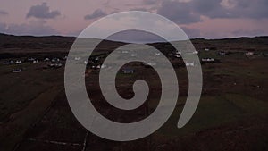 Reveal of homes and cottages on the Isle of Skye during sunset in Autumn