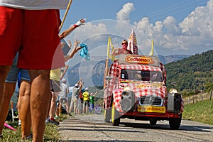 Spectators and advertsing caravan on the Tour de France roads