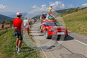 Red car of advertsing caravan on the Tour de France roads