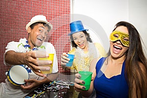Revelers making funny photo. Group of friends celebrate the Carnaval in Brazil.. photo