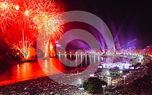 Revellers, both locals and tourist, enjoy the breath-taking New Years fireworks display along Copacabana Beach, Rio de