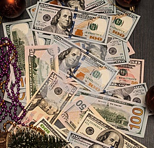 Revenue is expressed in cash under the Christmas tree, New Year`s motive.