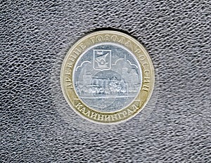 Reverse commemorative 10 ruble coins with the image of the panorama,the coat of arms of the city