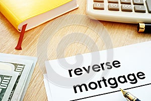 Reverse mortgage concept. Documents and calculator on a desk.