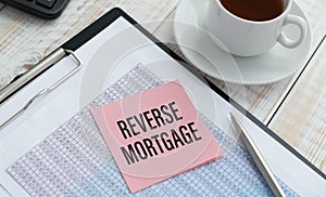 Reverse mortgage form on a table and cup coffee