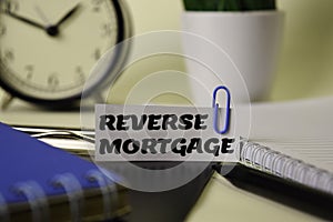 Reverse Mortgage on the paper isolated on it desk. Business and inspiration concept