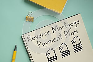 Reverse Mortgage Payment Plan is shown on the photo using the text