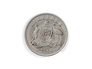 Reverse of old Australia coin six pence 1958 with emblem of Australia, isolated in white background. photo