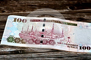 Reverse side of Saudi Arabia 100 SAR one hundred riyals cash money banknote with the photo of prophet Medina mosque isolated