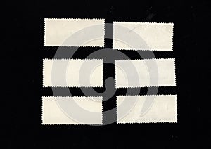 Reverse side of stamp isolated on black background. Postage stamp frame pattern
