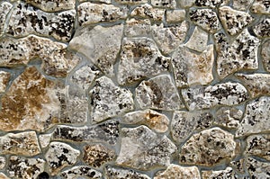 Revetment of wall with stone tile in monastery. Background stone shape