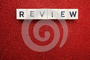 Review alphabet letter with space copy on red glitter background