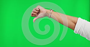 Review, bad and a thumbs down hand on a green screen isolated on a studio background. Vote, disagree and a person with a