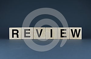 Review. The cubes form the word Review. The extensive concept of the word Review