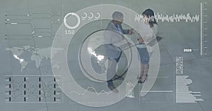 Reviewing data, two colleagues in suits pointing at laptops in modern lobby with AR overlays