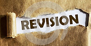 Revision text is written on torn paper