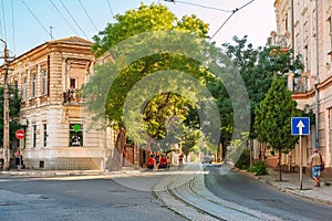 Revolution street in the old district of the city of Yevpatoria, with old buildings and single-track tram tracks